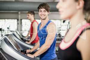 Athletic man running on treadmill