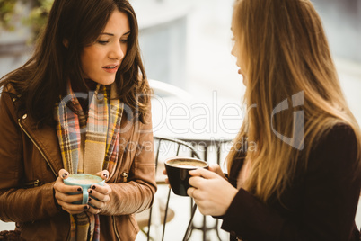 Friends chatting over coffee