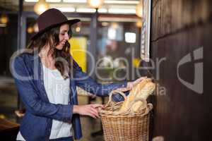 Smiling woman looking at bread