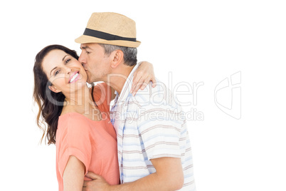 Husband kissing his wife on the cheek