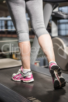 Lower section of a woman on a treadmill
