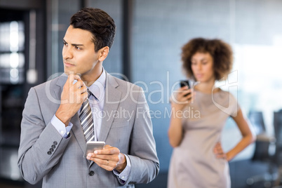 Good looking businessman looking away