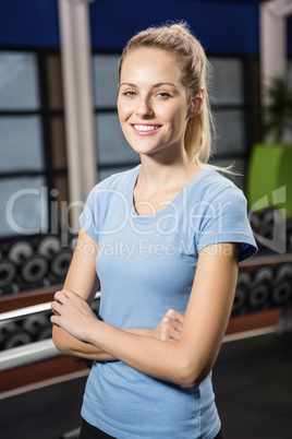 Portrait of smiling blonde with arms crossed