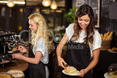 Pretty waitresses behind the counter working