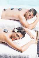 Couple getting a hot stone massage