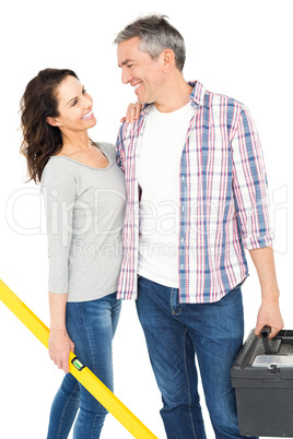 Couple with toolbox and bubble level