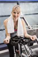 Fit woman on exercise bike