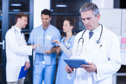 Doctor using tablet in hospital Doctor using tablet in hospital