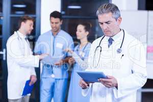 Doctor using tablet in hospital