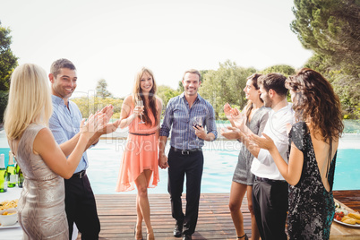 Happy young friends having drinks