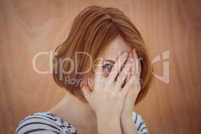 beautiful hipster woman hiding her face