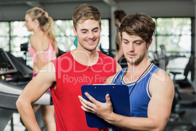 Male trainer discussing about performance