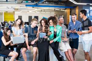 Group of colleagues talking in office