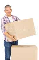 Happy man posing with moving boxes