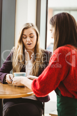 Cute friends having coffee