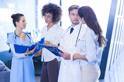 Doctors looking at medical report