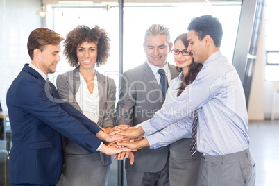 Businesspeople hands stacked over each other