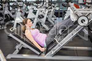 Woman using leg press