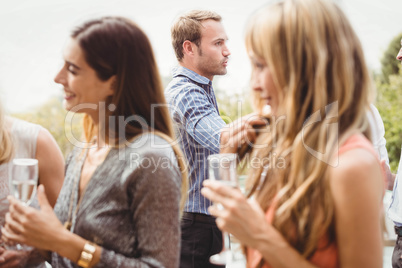 Happy young friends having drinks