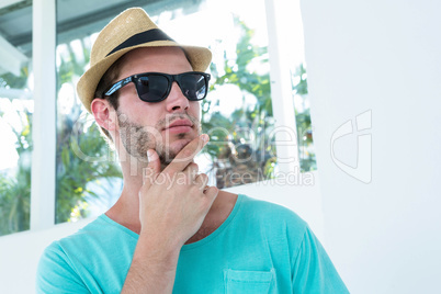 Hipster man posing with sunglasses