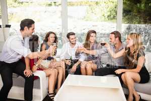 Group of friends talking and having drinks