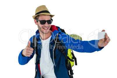 Backpacker hipster taking a selfie