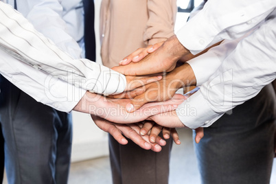 Close-up of businesspeople stacking hands