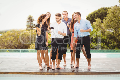 Happy young friends having drinks