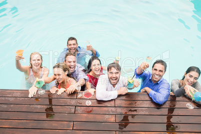 Happy young friends having drinks