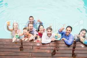 Happy young friends having drinks