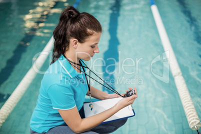 Trainer woman holding a stopwatch