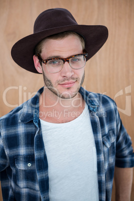 Handsome hipster wearing nerd glasses and hat