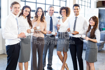 Businesspeople standing together in office