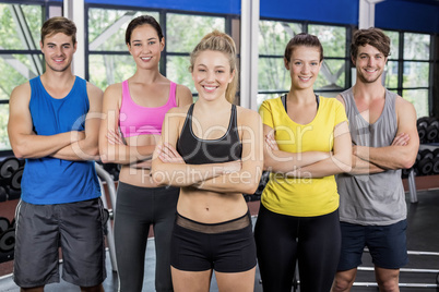 Athletic smiling women and men posing