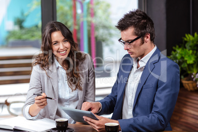 People using tablet and notebook