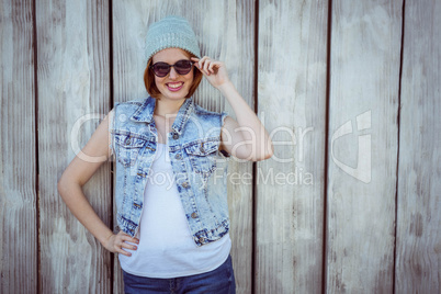 smiling hipster woman wearing a beanie hat