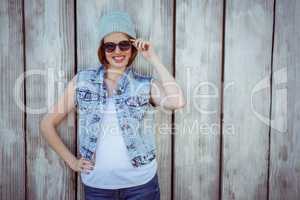 smiling hipster woman wearing a beanie hat