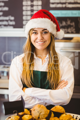 Cute waitress standing behind the counter