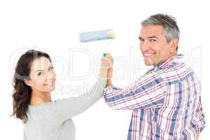 Couple painting with roller