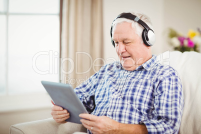 Senior man listening to music