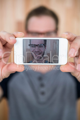 Handsome hipster taking a selfie