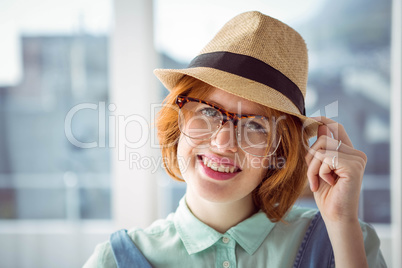 Cute red haired hipster with glasses