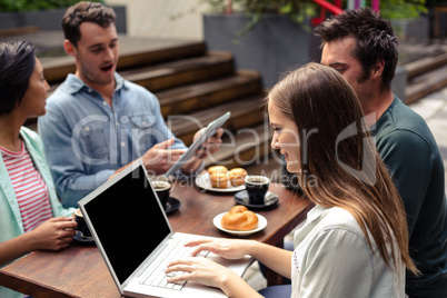 Smiling woman using laptop