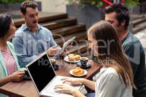 Smiling woman using laptop