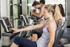 Fit people doing exercise bike