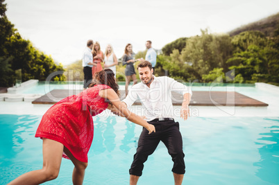 Friends having fun at swimming pool