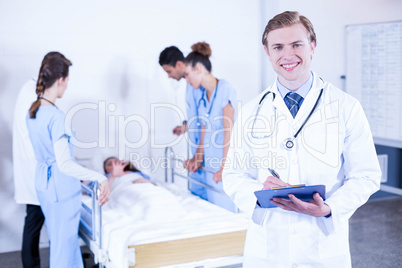 Portrait of doctor holding clipboard