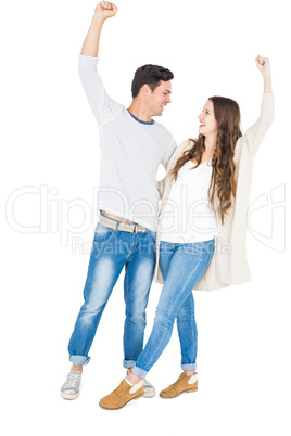 Triumphant couple raising fist