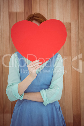 Pretty hipster holding heart