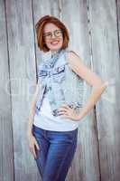smiling hipster woman with her hands on her hip